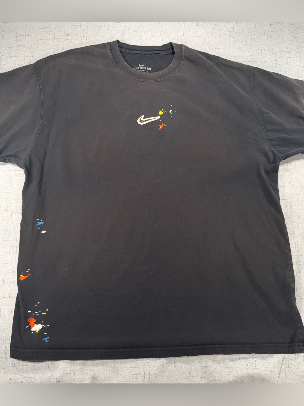 Nike Men’s Black Short-Sleeve Tee with Paint-Splash Swoosh
